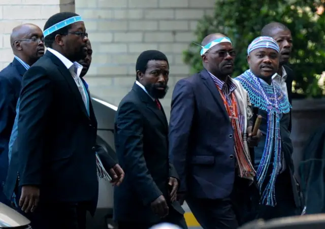 King Buyelekhaya Dalindyebo (C) flanked by chiefs, arrives on July 9, 2013 to visit former South African President Nelson Mandela at the MediClinic Heart Hospital in Pretoria