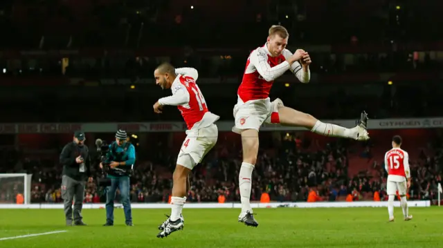 Theo Walcott and Per Mertesacker