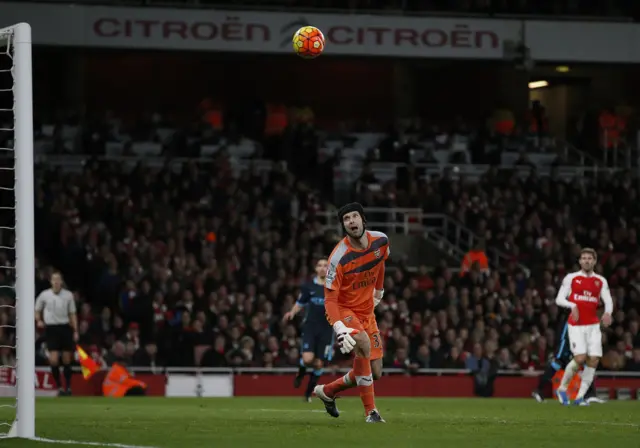 Petr Cech watches as Yaya Toure scores for Man City