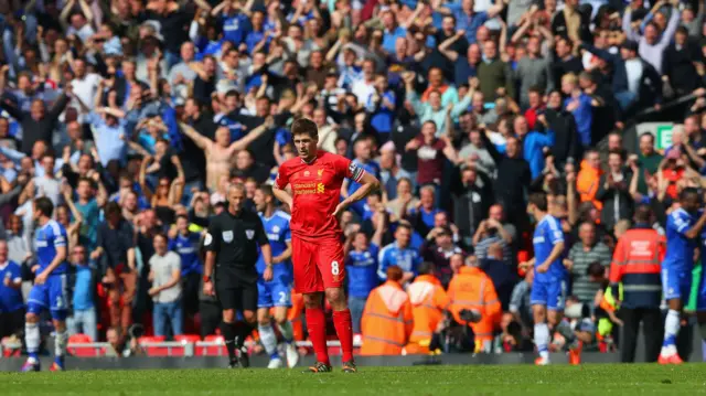 Chelsea fans celebrate scoring, thanks in part to Steven Gerrard's slip at Anfield