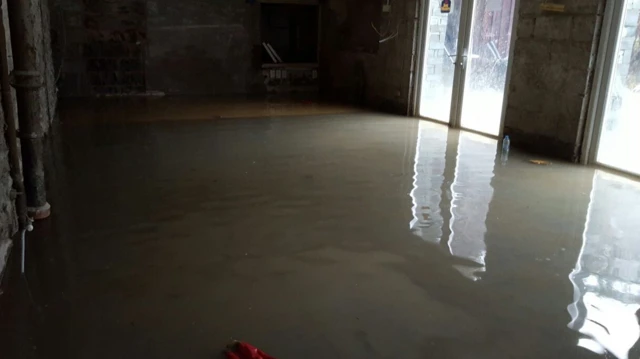 Flooded bar with plaster stripped