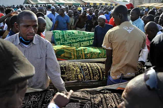 The bodies of five of the victims of last week's attack are taken for burial during their funeral in Bamako, on November 25, 2015