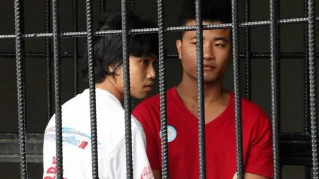 Wai Phyo (left) and Zaw Lin behind bars