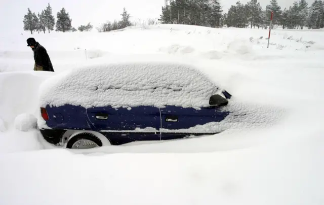 Car abandoned in snow