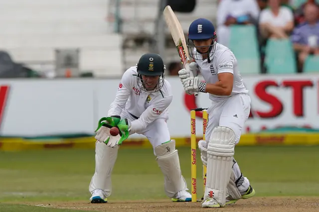 Wicket keeper AB de Villiers catches the ball after England's batsman James Taylor swung