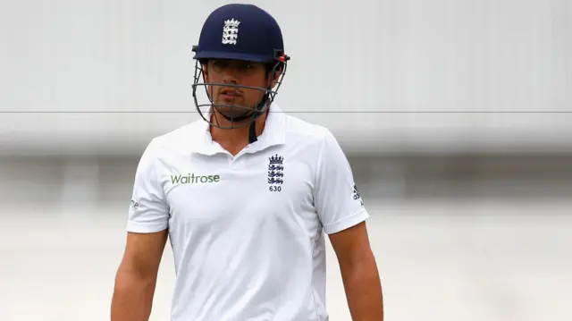 Alastair Cook of England walks off