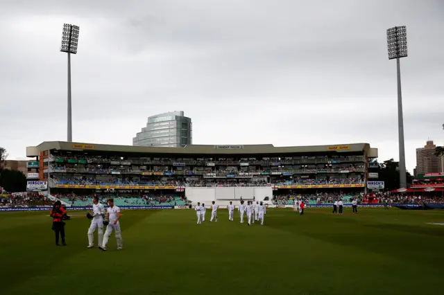 Alex Hales and Nick Compton of England walk off as rain returns