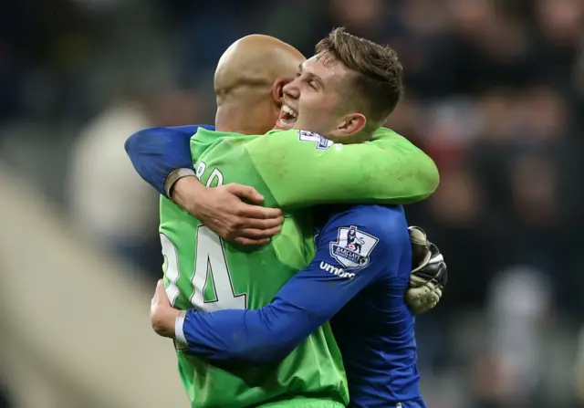 John Stones and Tim Howard celebrate