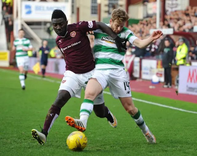 Hearts' Prince Buaben and Celtic's Stuart Armstrong compete for the ball