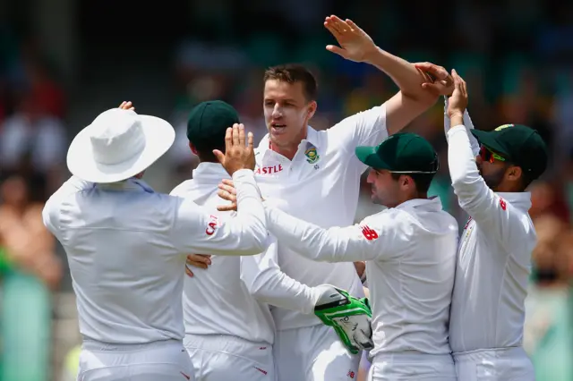 Morne Morkel of South Africa celebrates taking the wicket of Nick Compton