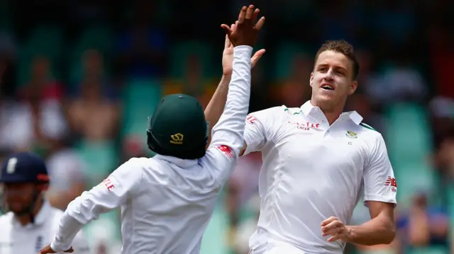 Morne Morkel of South Africa celebrates taking the wicket of Moeen Ali