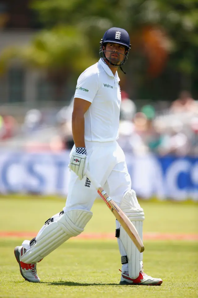 Alastair Cook walks off