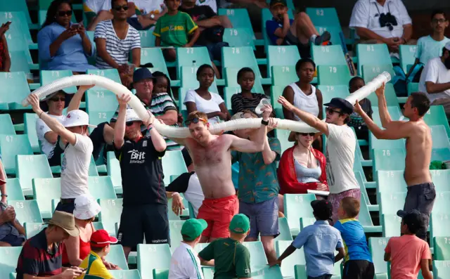 Fans with a beer snake