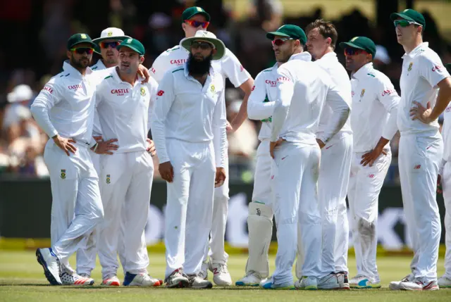 South Africa's players wait for a review decision