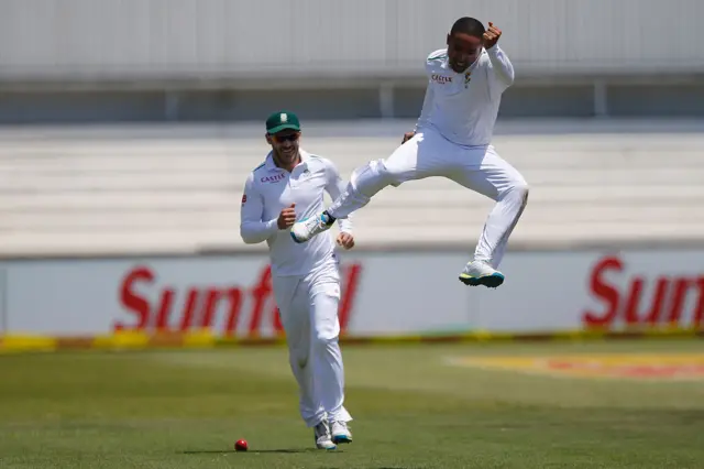 Dane Piedt celebrates the wicket of Alastair Cook