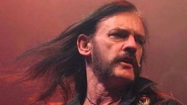 Lemmy in full rock flow, hair flowing behind