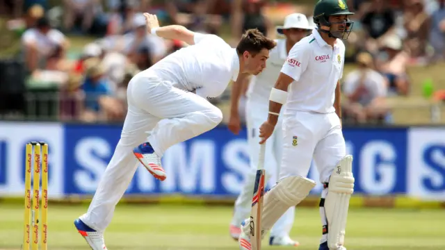 Chris Woakes of England bowls