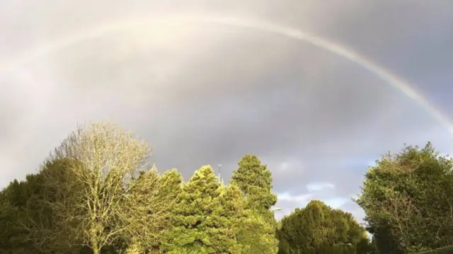 Rainbow over woodland in Gnosall