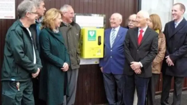 From the back (left) Ken Baxter and Jack Inman representing Uttoxeter Knights and Bob Beaumont representing the Village Hall Committee