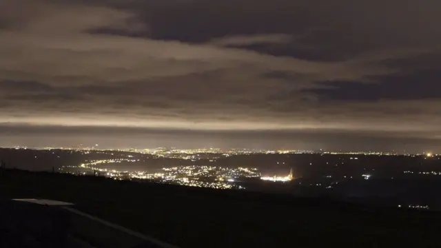 Leek at night with town lit up