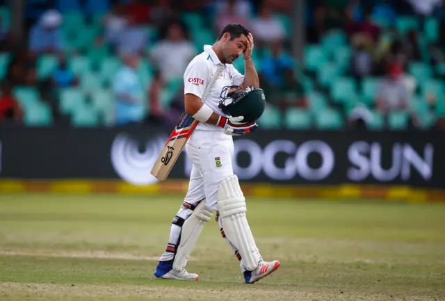 Dean Elgar of South Africa walks off