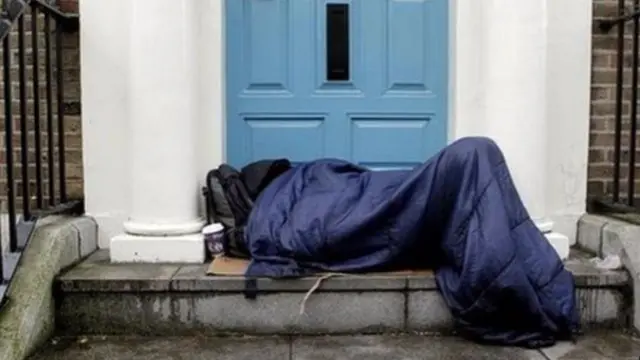 Homeless person in a sleeping bag