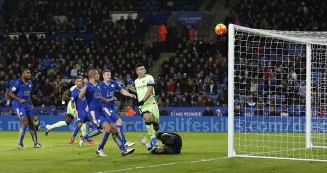 Sergio Aguero shoots over