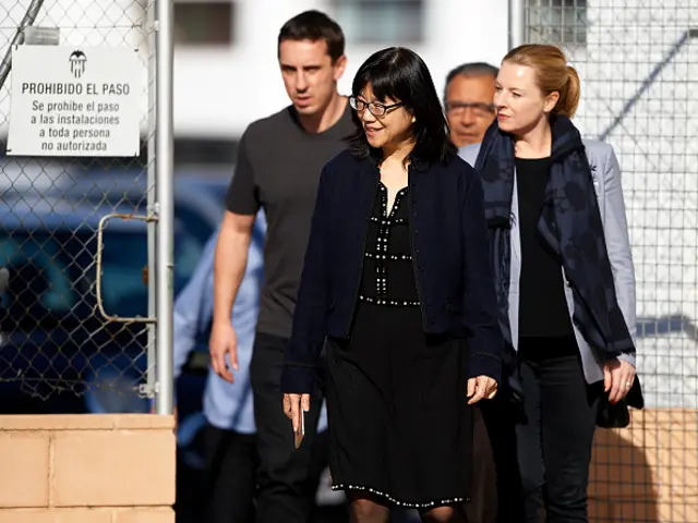 Valencia CF president Lay Hoon Chan and new coach of Valencia CF Gary Neville arrive at Paterna Training Centre