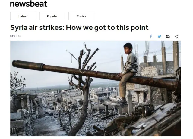 A child on a destroyed tank in Syria