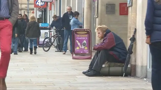 Man sat on bag in Oxford