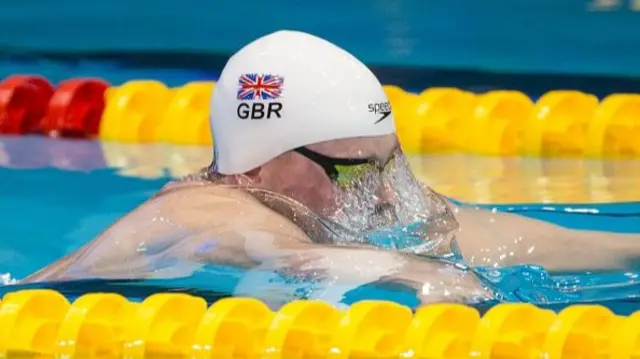 Adam Peaty competitng