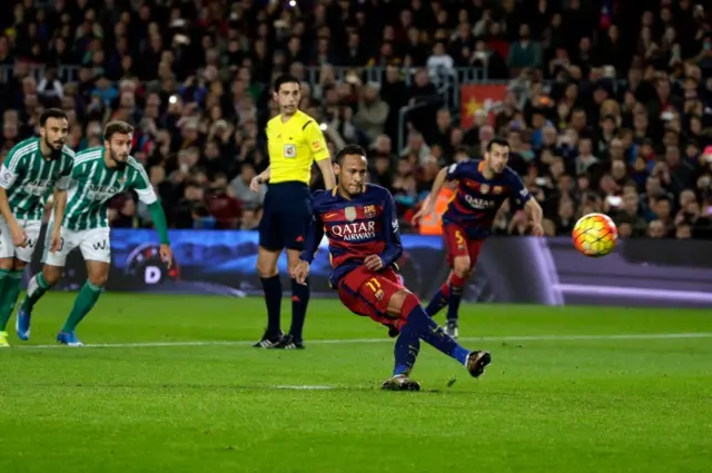 Neymar slips while taking a penalty