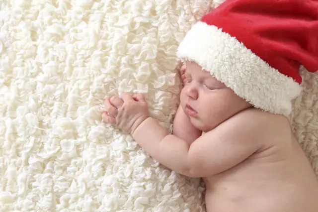Baby in a Christmas hat