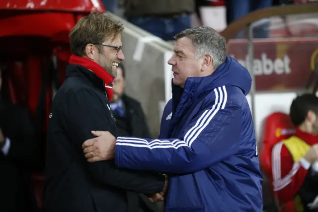 Managers shake hands pre-match