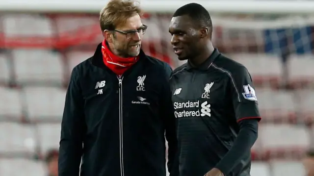 Juergen Klopp talks with Christian Benteke