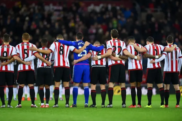 Sunderland players observe a minute's silence