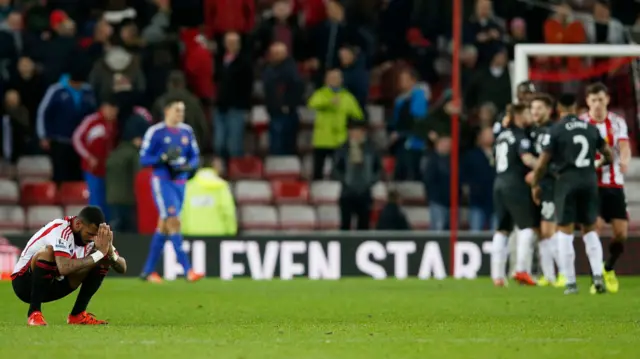 Yann M'Vila looks dejected