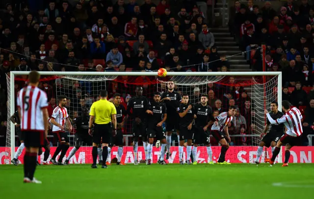 Adam Johnson takes a free-kick