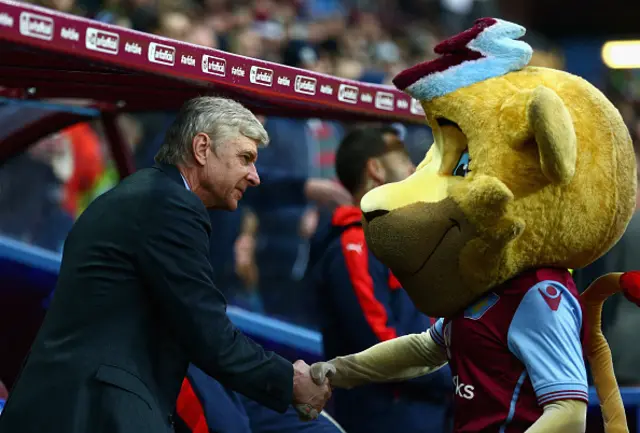 Arsenal manager Arsene Wenger (left) with Aston Villa's mascot