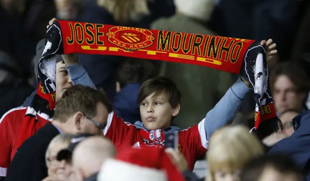 A Manchester United fan shows his support for Jose Mourinho