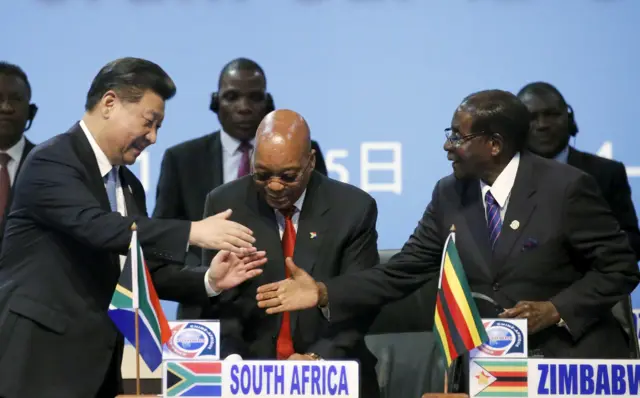 Xi, Zuma and Mugabe shaking hands