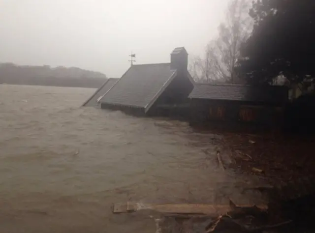 A church building half submerged