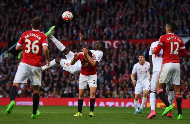 Christian Benteke scores for Liverpool at Old Trafford