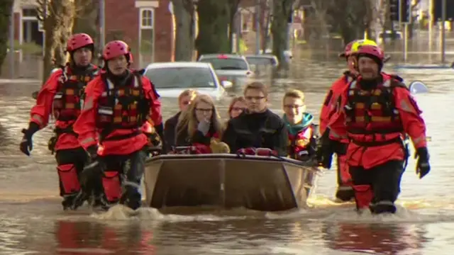 People rescued in a boat