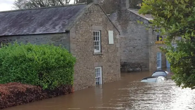 Cars submerged in flood water