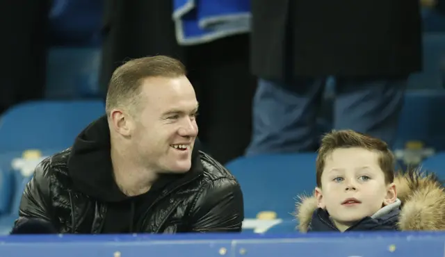 Wayne Rooney sat in the stands with his son