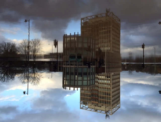 Carlisle Civic centre, reflected in calm floodwater