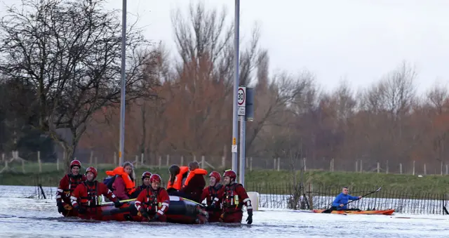 Rescue workers help residents to safety in Carlisle