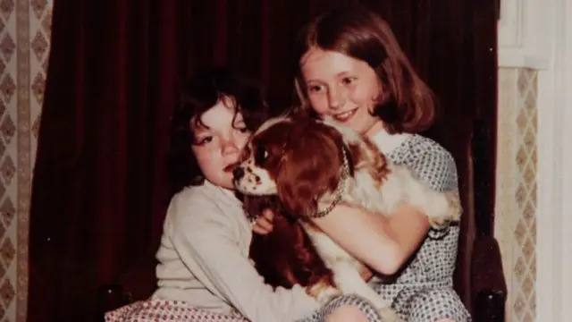 Claudia with sister and dog