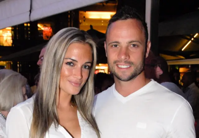 A picture taken on January 26, 2013 shows Olympian sprinter Oscar Pistorius posing next to his girlfriend Reeva Steenkamp at Melrose Arch in Johannesburg
